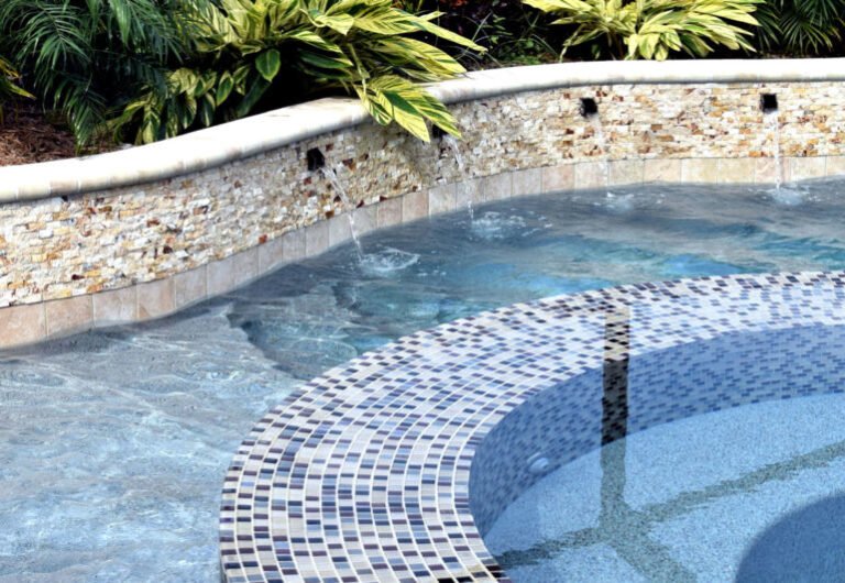 Pool technician repairing cracked pool tiles with precision and care.