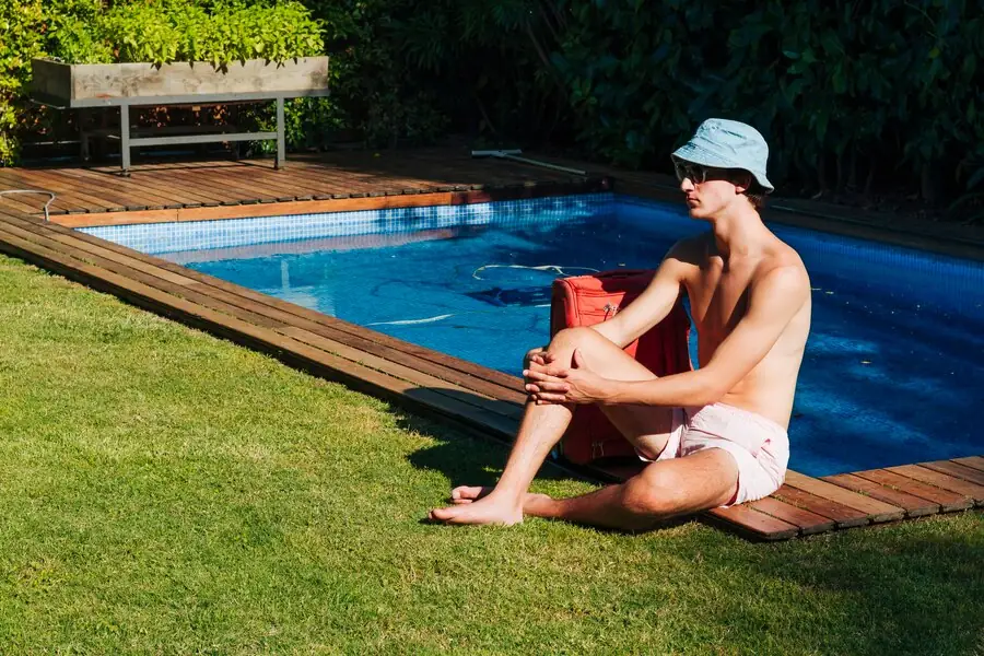 men beside pool